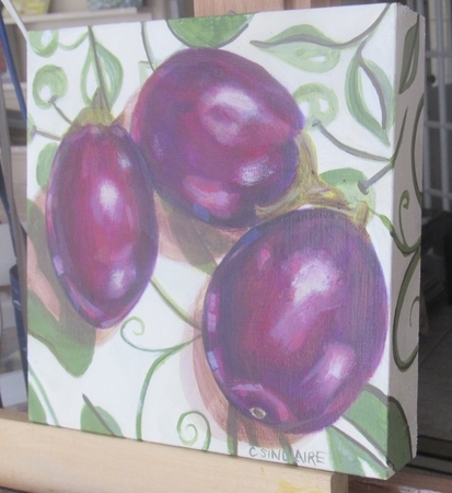 Eggplants on a Green and White Tablecloth